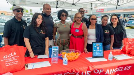 Asm. McKinnor and Council Member Faulk with Girls Club of Los Angeles booth staffers