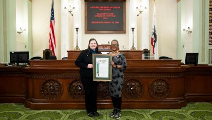 Asm. McKinnor honoring Elizabeth Kane as Woman of the Year on the Assembly Floor